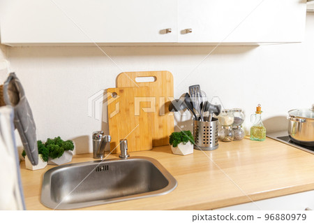 Scandinavian classic minimalistic kitchen with white and wooden details. Modern white kitchen clean contemporary style interior design. 96880979