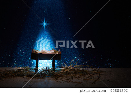 Nativity of Jesus, empty manger at night with bright lights. 96881292