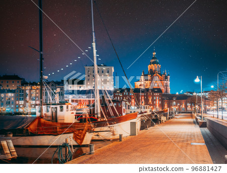 Helsinki, Finland. Bright Blue Starry Sky Above Pier With Boats, Pohjoisranta Street And View Of Uspenski Cathedral In Evening Night Illuminations. Light Blue Dramatic Sky. Azure Color Sky 96881427