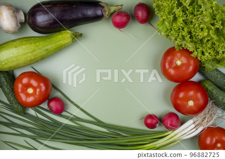 Fresh vegetables on a green background with a place to insert text Fresh vegetables on a green background with a place to insert text 96882725