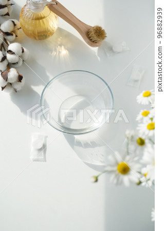 spa treatments. Facial care liquid in a cup on a white background. 96882939