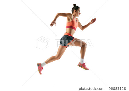 Dynamic portrait of professional female athlete, runner or jogger wearing summer sportswear running isolated on white background. Sport, fitness, motion, competition 96883128