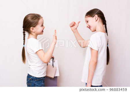 Girls meet after shopping and approve shopping 96883459