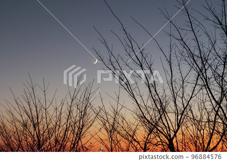 sunset with crescent moon 96884576