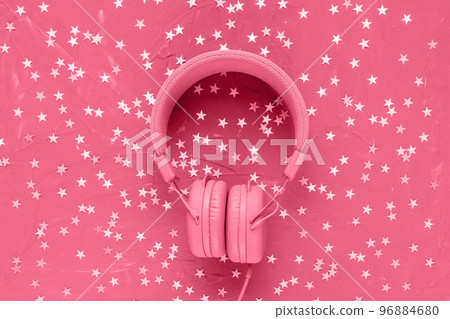 Headphones on festive red with stars confetti decoration background in color of the year 2023 Viva Magenta. Music, radio, podcasts, Christmas, New Year playlist concept. Top view, flat lay, copy space Headphones on festive red with stars confetti decoration background in color of the year 2023 Viva Magenta. Music, radio, podcasts, Christmas, New Year playlist concept. Top view, flat lay, copy space 96884680