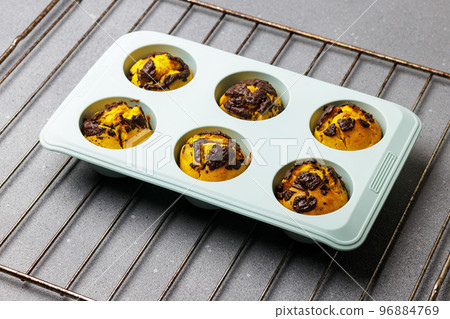 Pumpkin muffins baked in the silicone mold. Pumpkin muffins baked in the silicone mold. 96884769