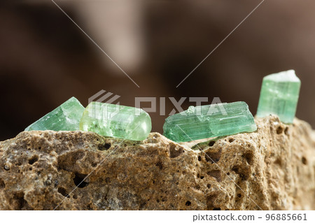 Set of Tourmaline Crystals on Rough Stone Background Set of Tourmaline Crystals on Rough Stone Background 96885661