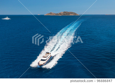 Aerial view of beautiful luxury yacht and boat in blue sea Aerial view of beautiful luxury yacht and boat in blue sea 96886847