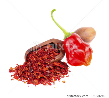 Fresh and dry ground red chili peppers isolated on white background. Capsicum baccatum or Bishop's crown pepper. 96886969