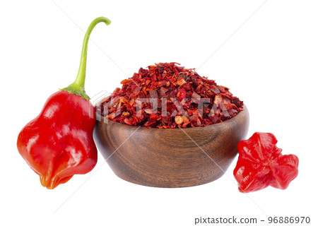 Fresh and dry ground red chili peppers isolated on white background. Capsicum baccatum or Bishop's crown pepper. 96886970