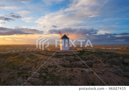Windmills. These iconic towers over their skylines of la Mancha.  96887435