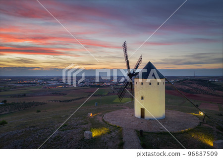 Windmills. These iconic towers over their skylines of la Mancha.  96887509