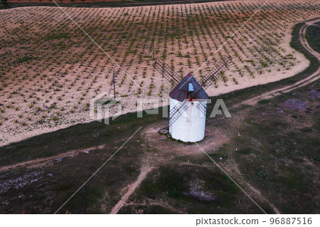 Windmills. These iconic towers over their skylines of la Mancha.  96887516