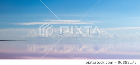 Pink salt lake water with clouds and blue sky Pink salt lake water with clouds and blue sky 96888173
