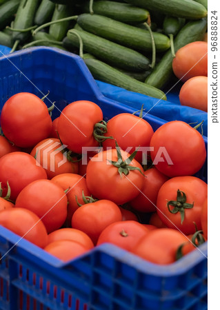 Fresh red tomatoes in boxes. Vegetables in local farmers market or supermarket. Fresh red tomatoes in boxes. Vegetables in local farmers market or supermarket. 96888824