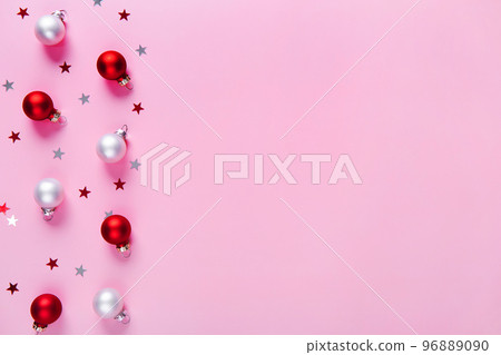 Creative holiday pattern. Christmas background of red and white baubles on a pink background. Creative holiday pattern. Christmas background of red and white baubles on a pink background. 96889090