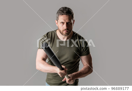 aggression of adult man with bat in studio. photo of man with aggression. man with aggression 96889177