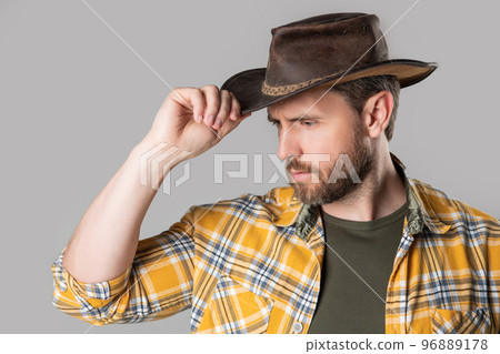 west man with cowboy hat isolated on grey background. west man in cowboy hat in studio. 96889178