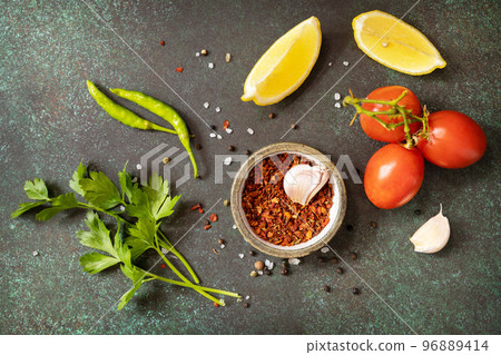 Healthy food vegetarian food background. Various herbs and spices for cooking on dark background. View from above. Healthy food vegetarian food background. Various herbs and spices for cooking on dark background. View from above. 96889414