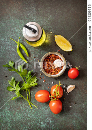 Healthy food vegetarian food background. Various herbs and spices for cooking on dark background. View from above. Healthy food vegetarian food background. Various herbs and spices for cooking on dark background. View from above. 96889416