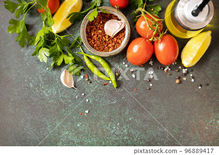 Healthy food vegetarian food background. Various herbs and spices for cooking on dark background. View from above. Copy space. Healthy food vegetarian food background. Various herbs and spices for cooking on dark background. View from above. Copy space. 96889417