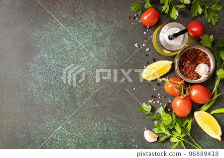 Healthy food vegetarian food background. Various herbs and spices for cooking on dark background. View from above. Copy space. Healthy food vegetarian food background. Various herbs and spices for cooking on dark background. View from above. Copy space. 96889418