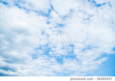 blue sky background with white fluffy clouds 96889507
