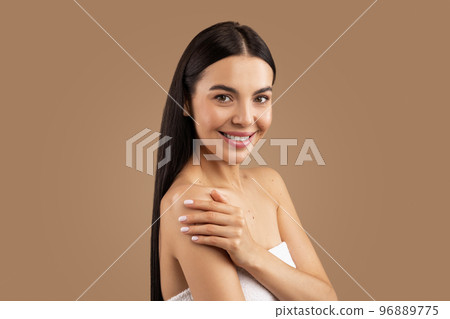 Beautiful half-naked young woman posing on beige studio background 96889775