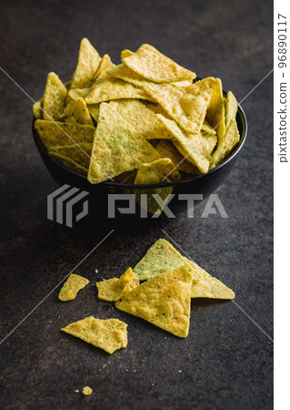 Tortilla chips with the flavor of jalapeno peppers in bowl. 96890117