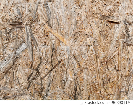 Particleboard wooden wet surface. Background and texture of OSB or MDF board. Close up. 96890119