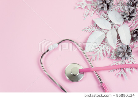 Stethoscope and Christmas decorations. Medical concept. Greeting card. New Year and Christmas. Stethoscope and Christmas decorations. Medical concept. Greeting card. New Year and Christmas. 96890124