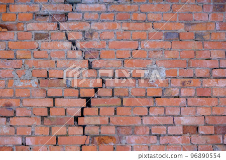 Cracked red brick wall. Brick wall background Cracked red brick wall. Brick wall background 96890554