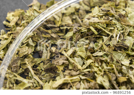 Medicinal milk thistle dried leaves. Alternative herb medicine ingredient. Macro 96891256