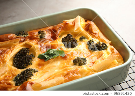 Tasty broccoli casserole in baking dish on cooling rack, closeup Tasty broccoli casserole in baking dish on cooling rack, closeup 96891420