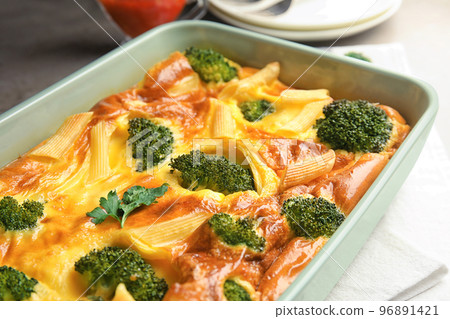 Tasty broccoli casserole in baking dish on table, closeup Tasty broccoli casserole in baking dish on table, closeup 96891421