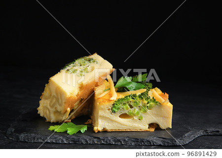 Tasty broccoli casserole served on black table Tasty broccoli casserole served on black table 96891429