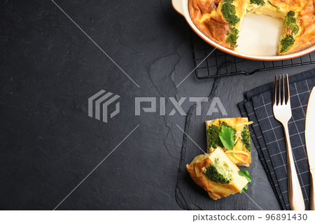 Tasty broccoli casserole served on black table, flat lay. Space for text Tasty broccoli casserole served on black table, flat lay. Space for text 96891430