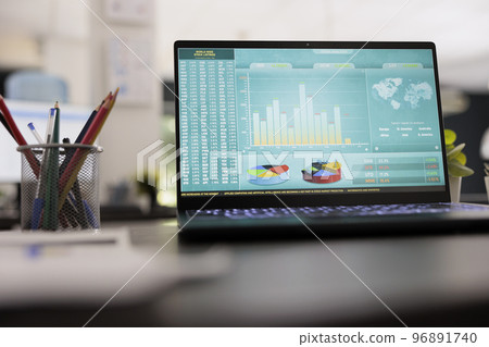 Stock market trade chart on laptop display on wooden table blurred photo background. Investment workplace with trading graphic, interior business marketing trader concept. Stock market trade chart on laptop display on wooden table blurred photo background. Investment workplace with trading graphic, interior business marketing trader concept. 96891740