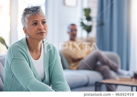 Divorce, fight and sad with couple in living room for depression, fail marriage and toxic partnership. Angry, conflict and frustrated with man and woman on sofa for mental health, crisis and argument 96892459