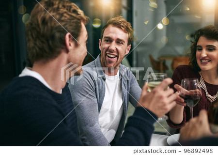 Laughing men, woman and wine glass toast in house, home or luxury restaurant for New Year, birthday party or celebration event. Smile, happy and bonding friends with alcohol drinks in success cheers Laughing men, woman and wine glass toast in house, home or luxury restaurant for New Year, birthday party or celebration event. Smile, happy and bonding friends with alcohol drinks in success cheers 96892498