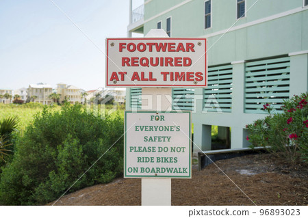 Sign with Footwear Required At All Times and Please Do Not Ride Bikes on Boardwalk at Destin, FL Sign with Footwear Required At All Times and Please Do Not Ride Bikes on Boardwalk at Destin, FL 96893023