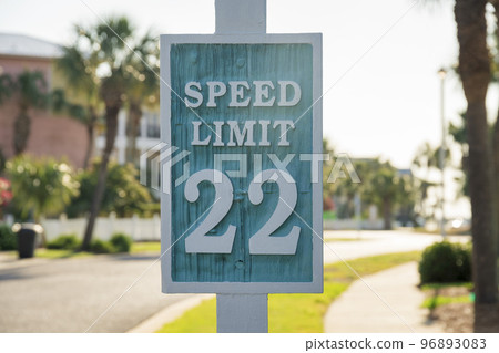 Destin, Florida- Carved road sign with Speed Limit 22 96893083