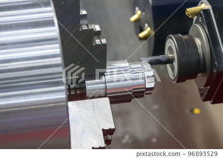 The multi-tasking CNC lathe machine  milling cutting the metal shaft parts by milling turret. 96893529