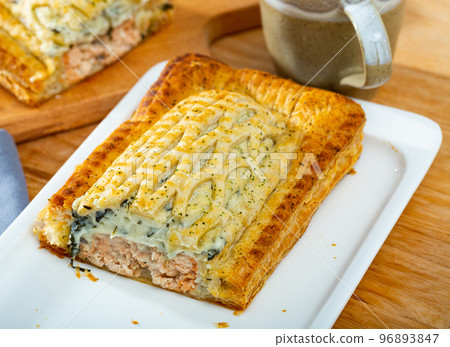 Delicious salmon puff pastry pie closeup 96893847