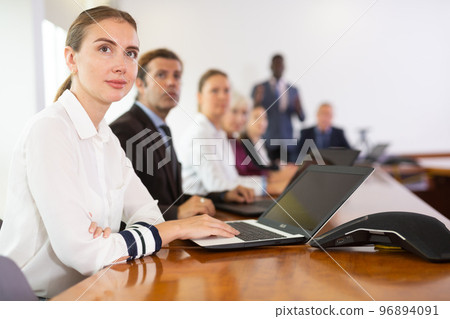 Portrait of business woman using laptop at business meeting Portrait of business woman using laptop at business meeting 96894091