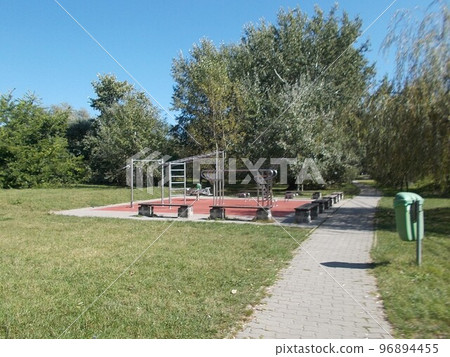 Playground equipment in the park on a sunny afternoon 96894455