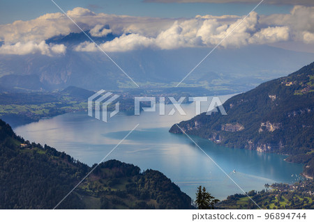 Aerial view of Swiss Alps and Lake Thun at dramatic sunset, Interlaken 96894744