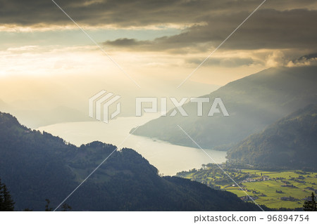 Aerial view of Swiss Alps and Lake Thun at dramatic sunset, Interlaken 96894754