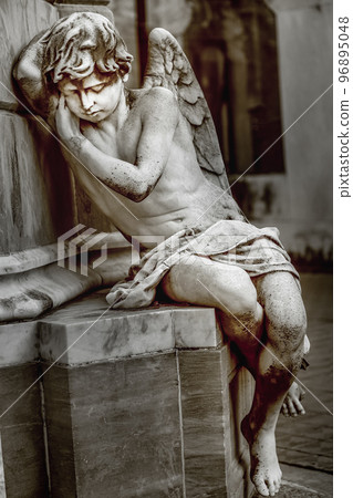 Young sad and beautiful fragile Angel, Recoleta cemetery, Buenos Aires 96895048