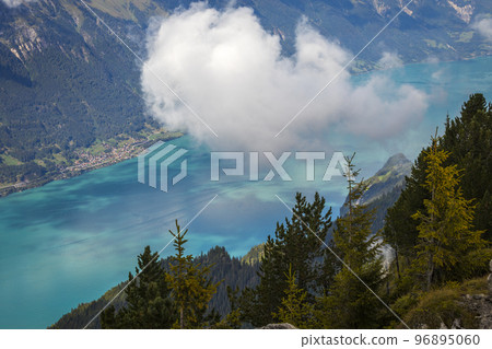 Aerial view of Swiss Alps and Lake Brienz with ferry boat at sunset, Interlaken 96895060